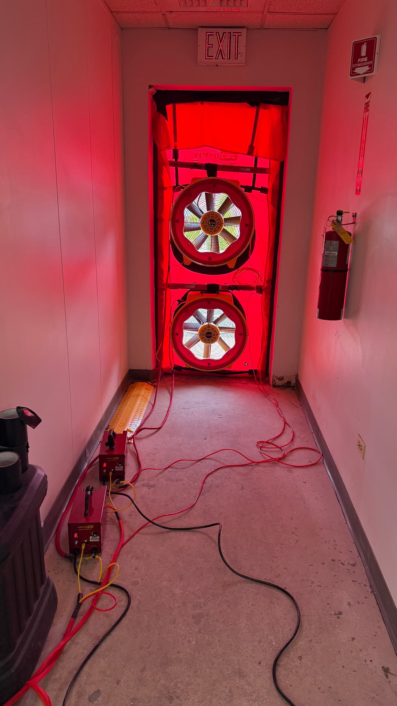 Dual blower door fan array installed in commercial doorway